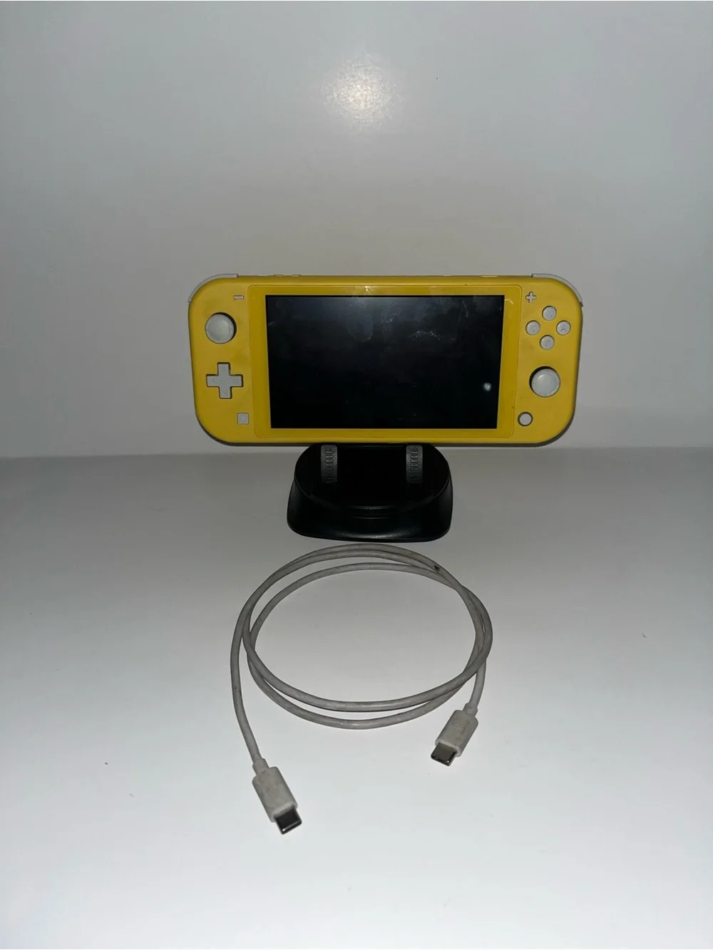 Yellow Nintendo switch light with charger